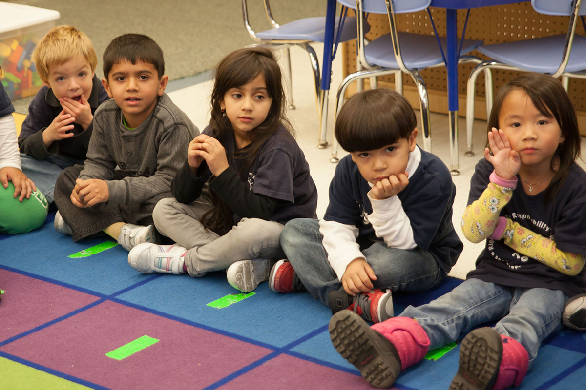 Students sitting on mat