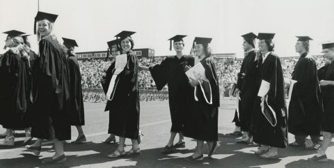 women in cap and gown