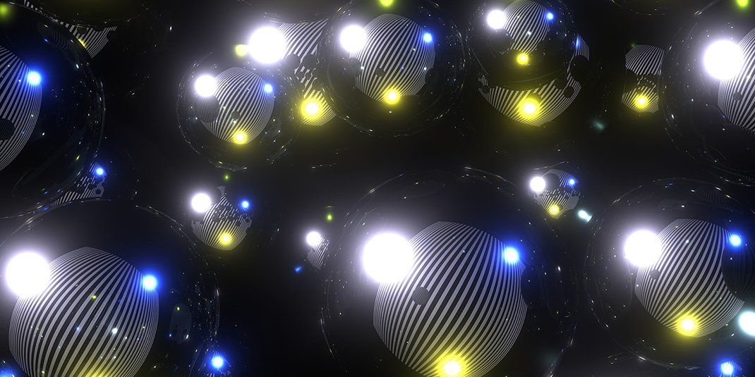 An abstract image with white, blue, and yellow lights against a black background