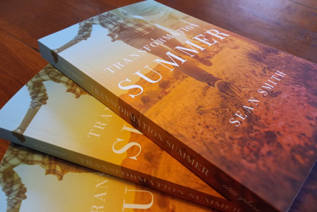 A group of "Transformation Summer" books