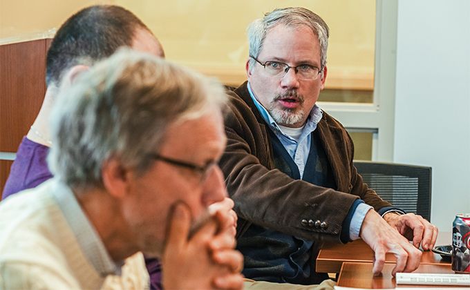 Group of people looking at a computer screen