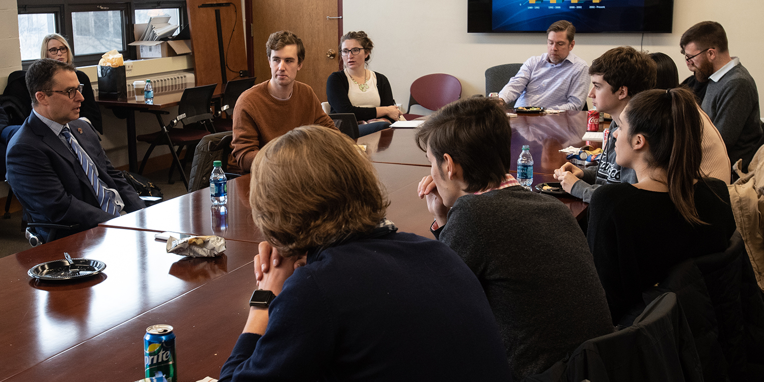 Students sit around the table at the Lunch with an Entrepreneur event