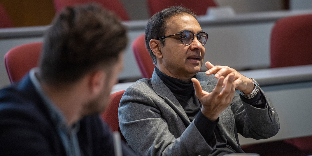 Mohan Subramaniam talking in a lecture hall