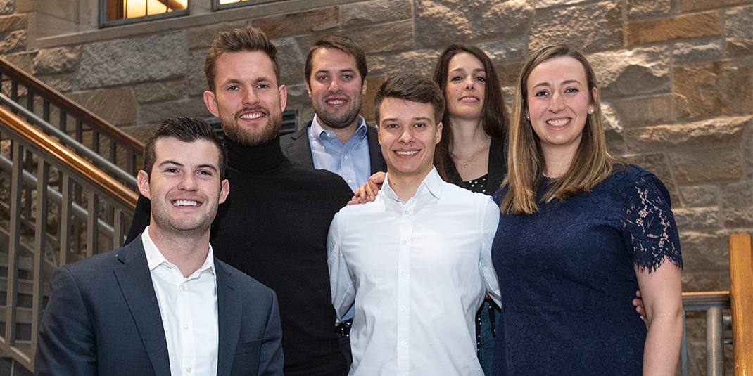 The group of 6 students who worked on the project pose in the Fulton Hall atrium