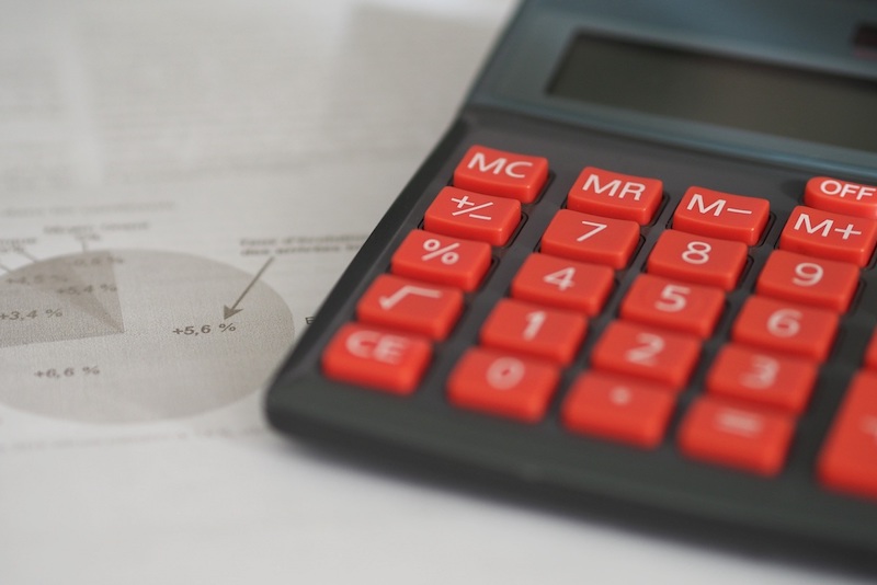 a calculator on top of a pie chart