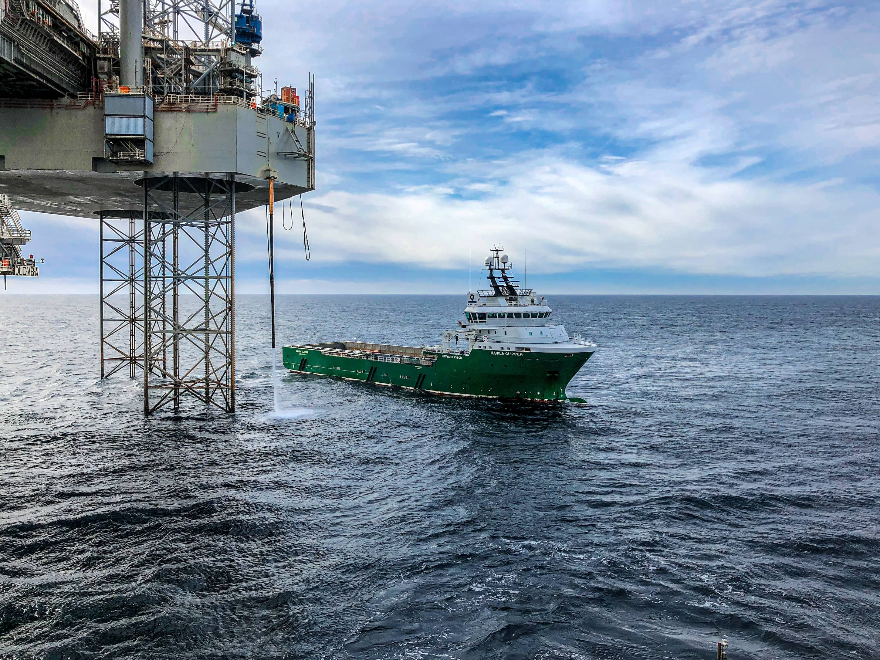 boat and mining platform over the ocean