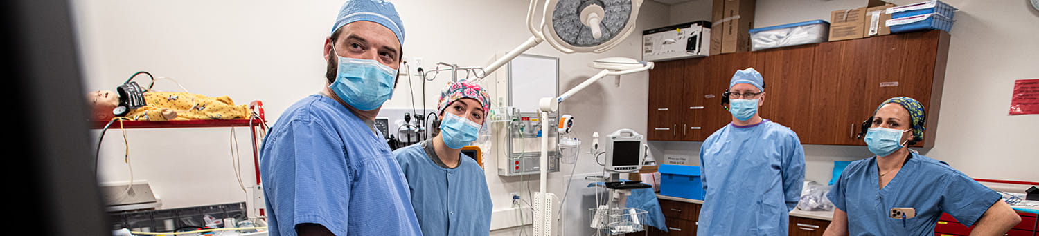 CSON professors with students in the simulation laboratory