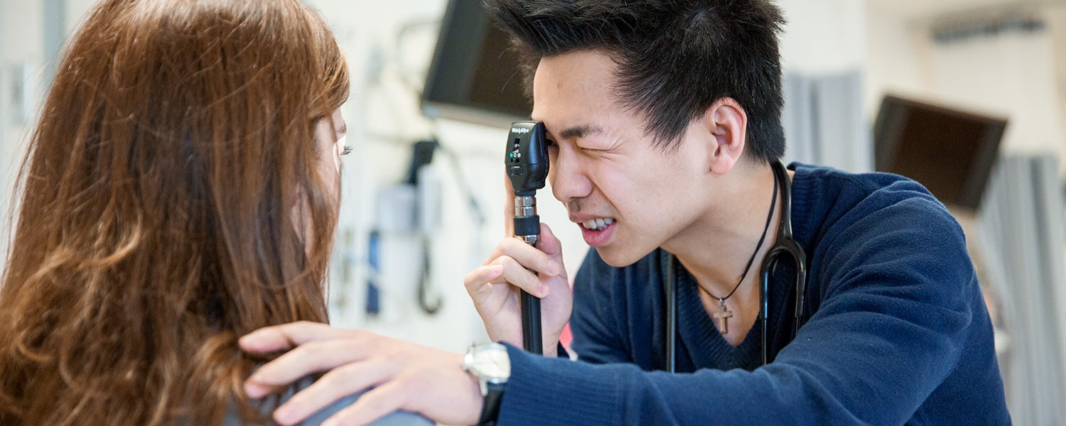 A person giving an eye exam