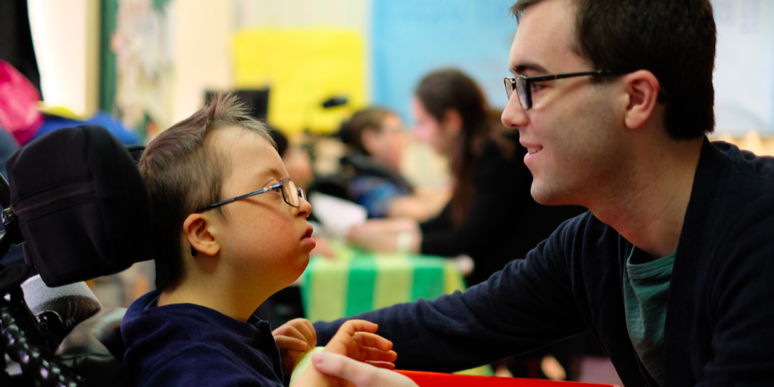 Campus School student Jack with volunteer Brian Eagan