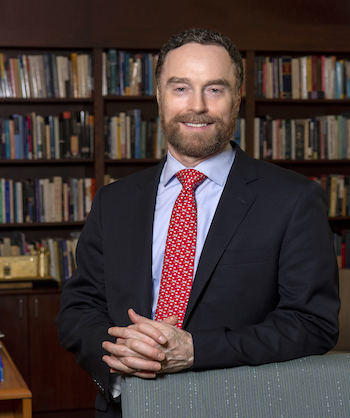 Updated portrait of Dean Stanton Wortham (LSOEHD) in his office in Campion Hall.
