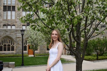 Image of student Grace Mayer standing outside Lyons Hall