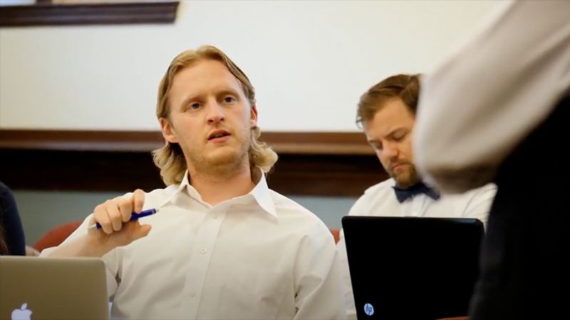 Poster image of student in class