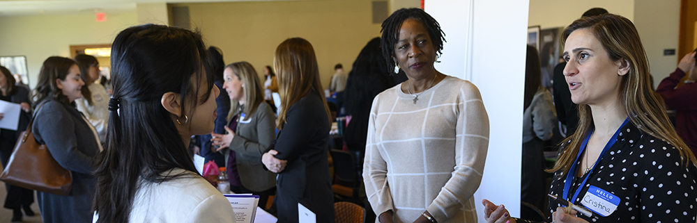 people speaking at a career fair