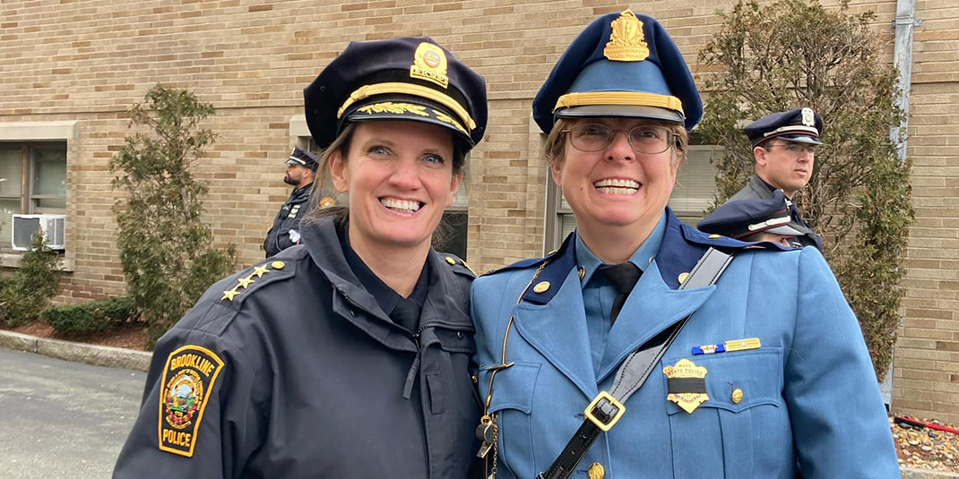 Jen Paster, left, and a colleague pose for a photo