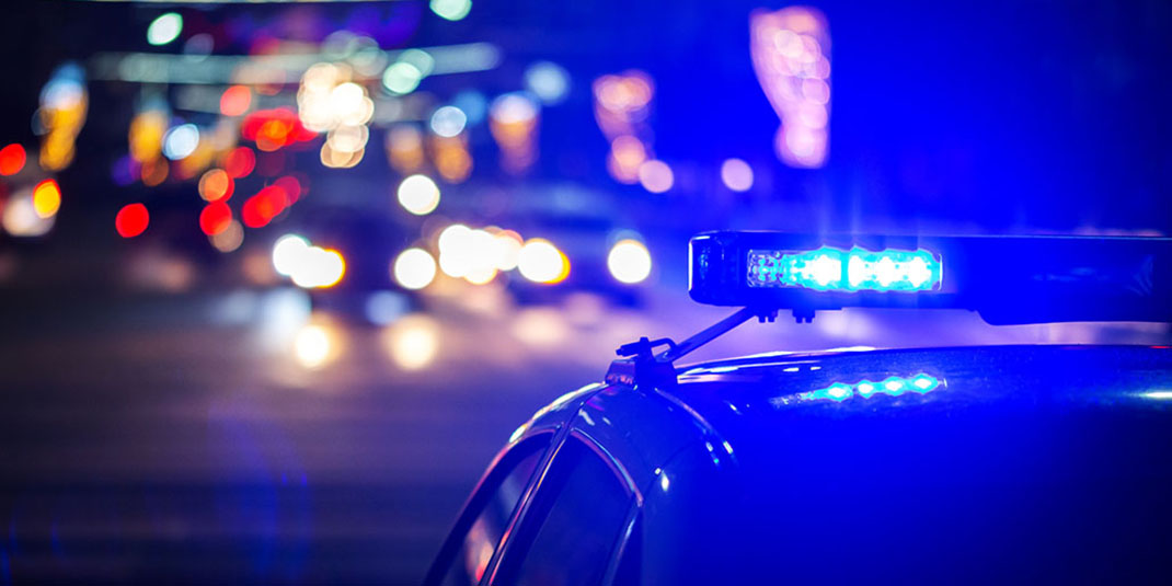 A police car with its siren on