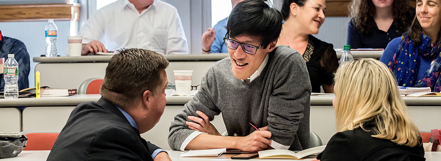 students talking in a classroom