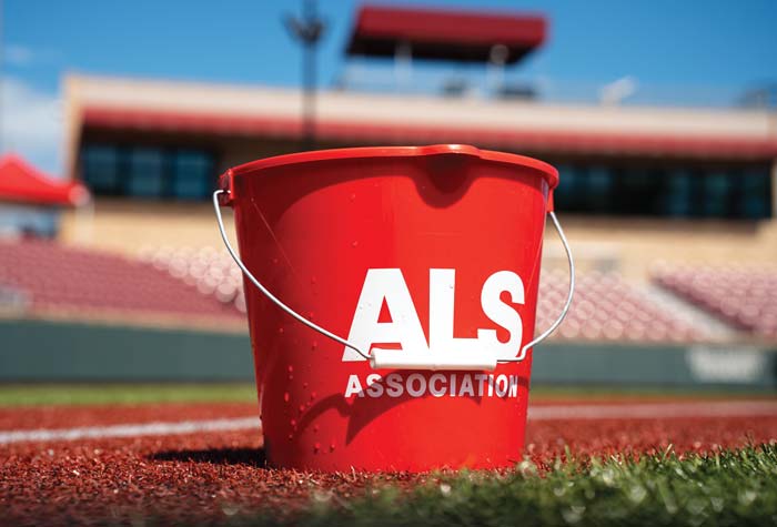 Photo of an ALS branded ice bucket on the turf of a baseball field