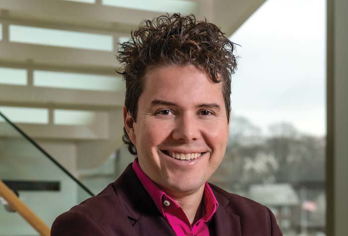 Serazio photographed with receding stairwell and skyline in background