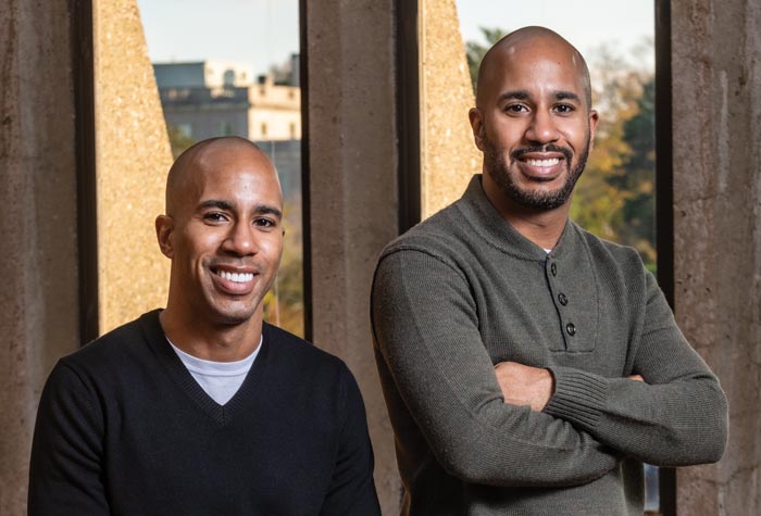 Desmon Lewis ’05 and Derrick Lewis ’06 photographed in the School of Theology and Ministry Library