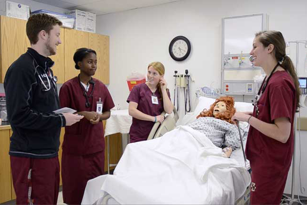 students in scrubs in a hospital setting