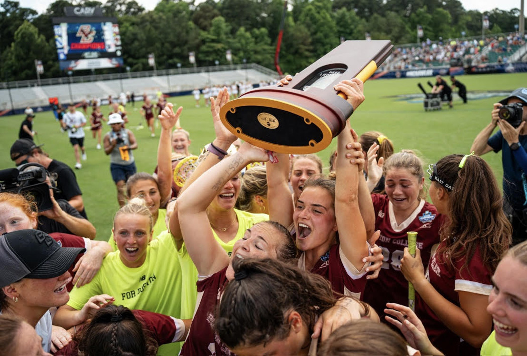 women's lacrosse team with championship tropht
