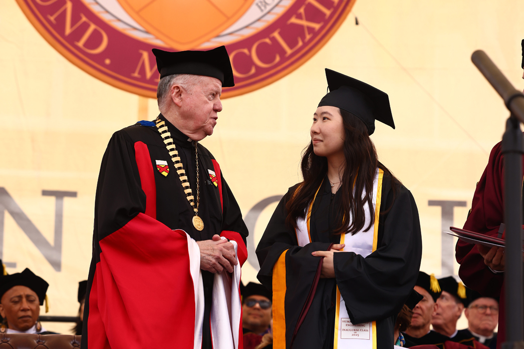 Finnegan Award winner in cap and gown