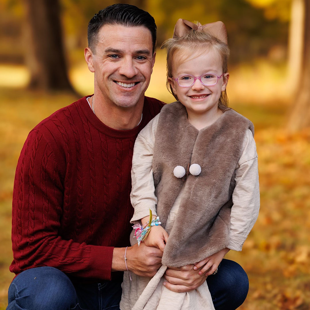 A man and child outside