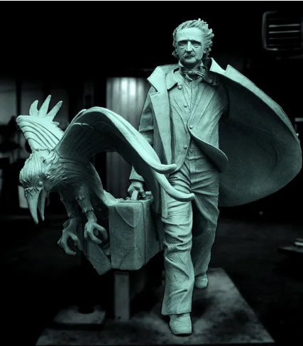 status of Edgar Allan Poe holding a suitcase, accompanied by a giant raven