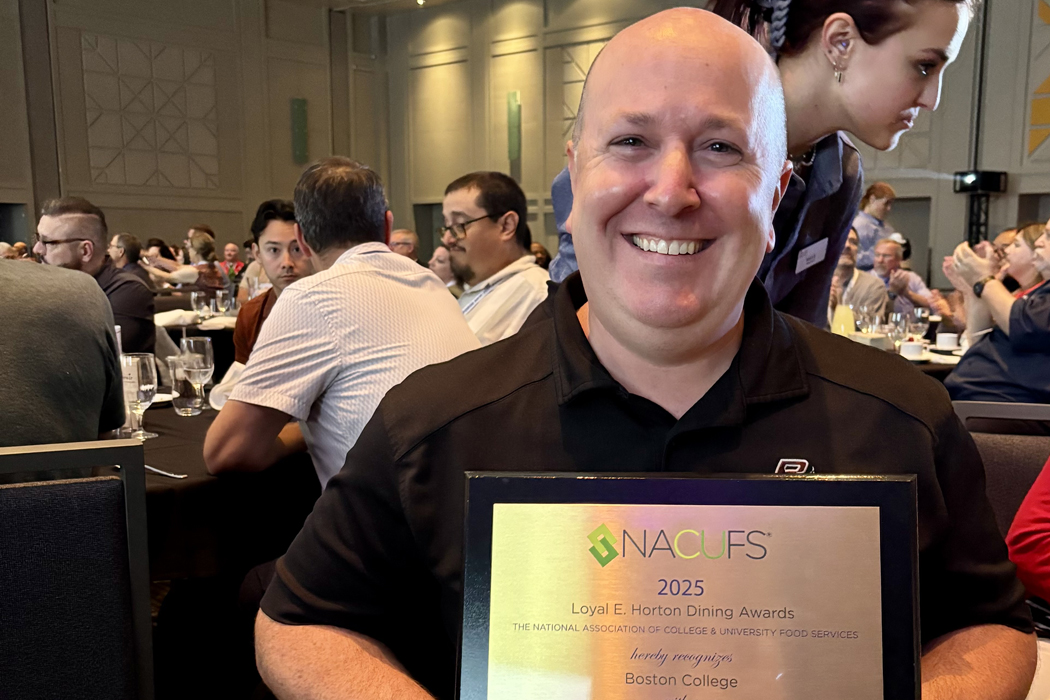Scott Powers holding a plaque