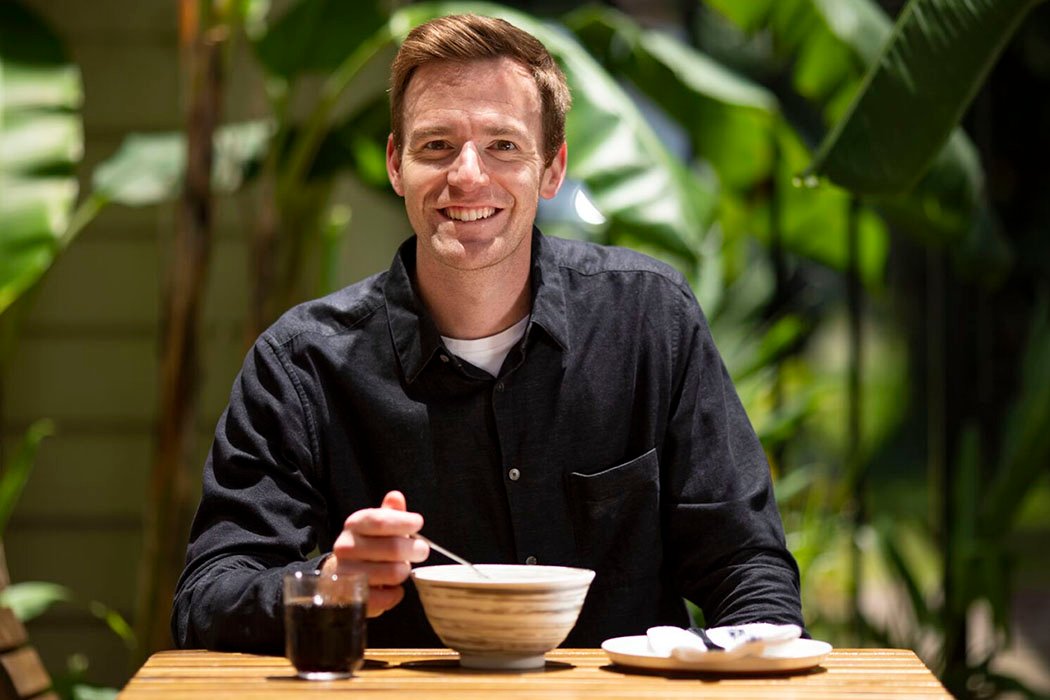 Parker Milner sitting down at a restaurant