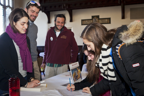 The Civic Engagement Fair in Gasson 100, giving students the opportunity to engage with representatives of a variety of campus, neighborhood, and Boston-based volunteering organizations.

Katie Michalik '16 (pink scarf) and Courtney Papes '16 talk with Jacqueline Chiofalo '13, Quentin Orem, grad '14, and Anthony Ford A&S '13 from Eagle Volunteers. 
